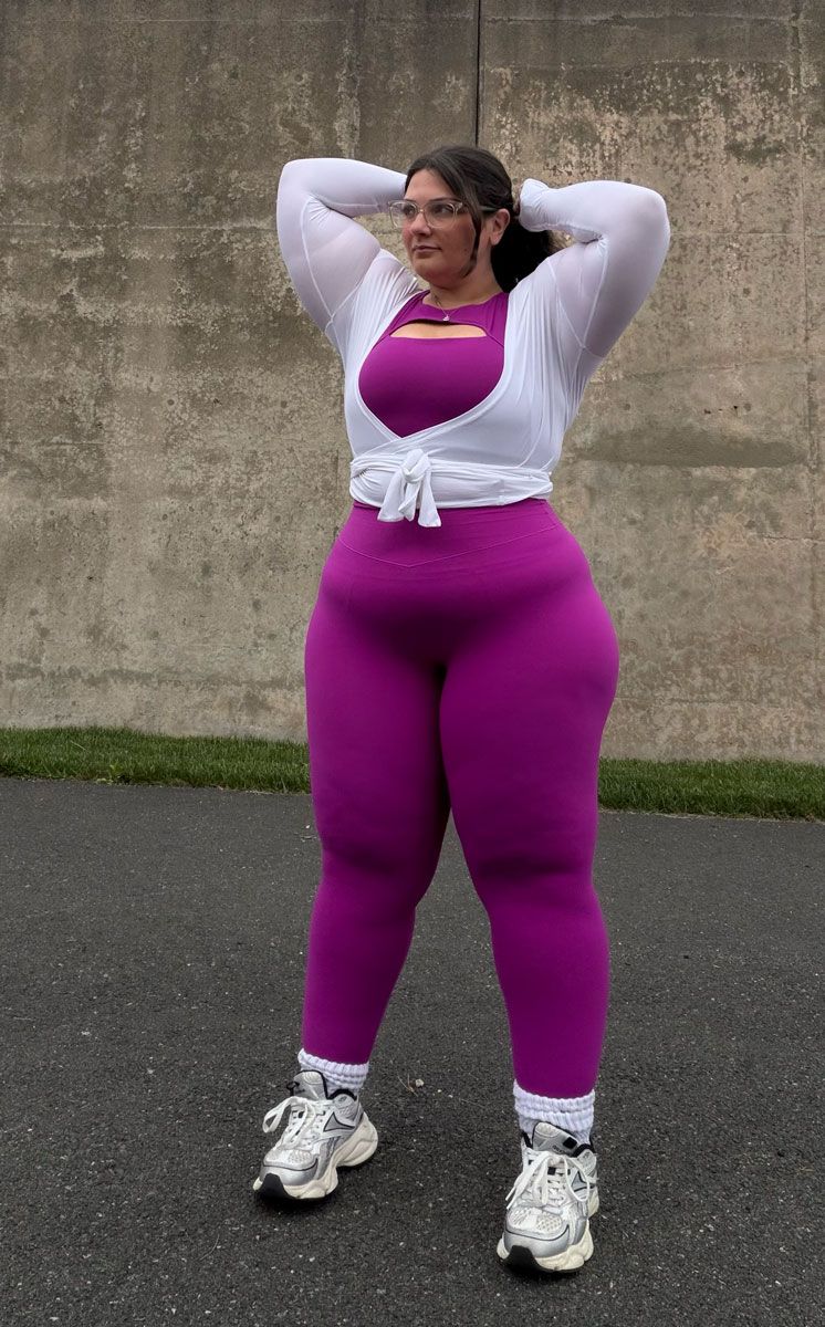 The coach is posing with her confidence.
