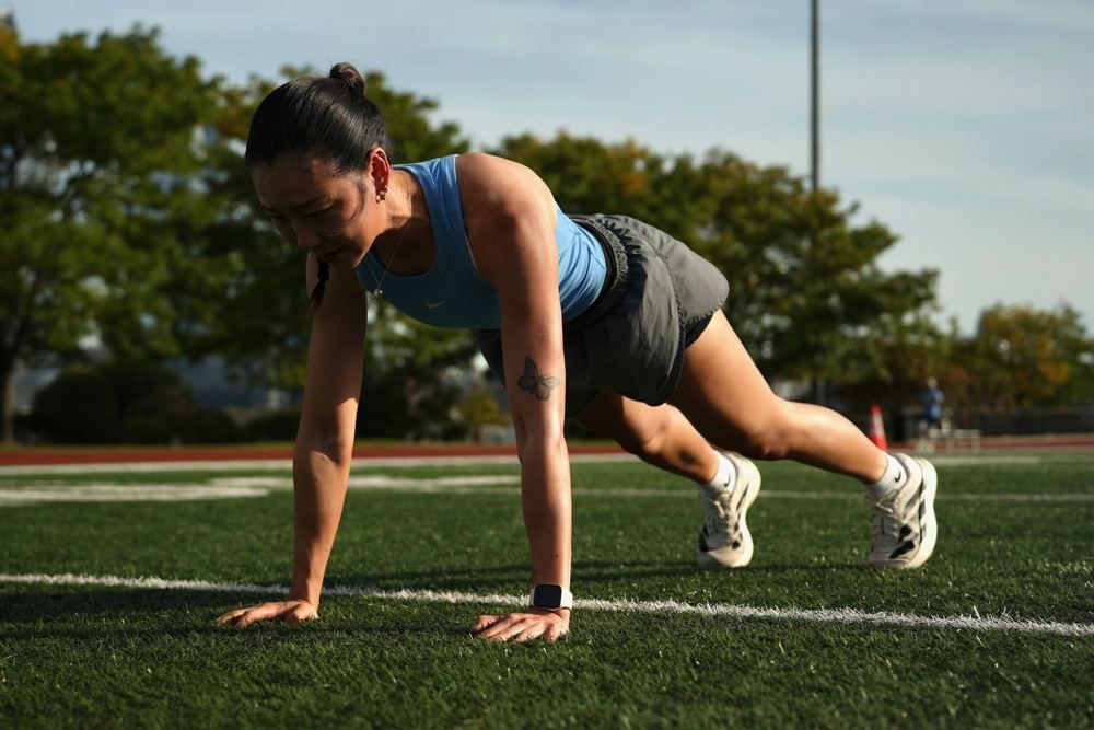 Jules holding a plank on the field