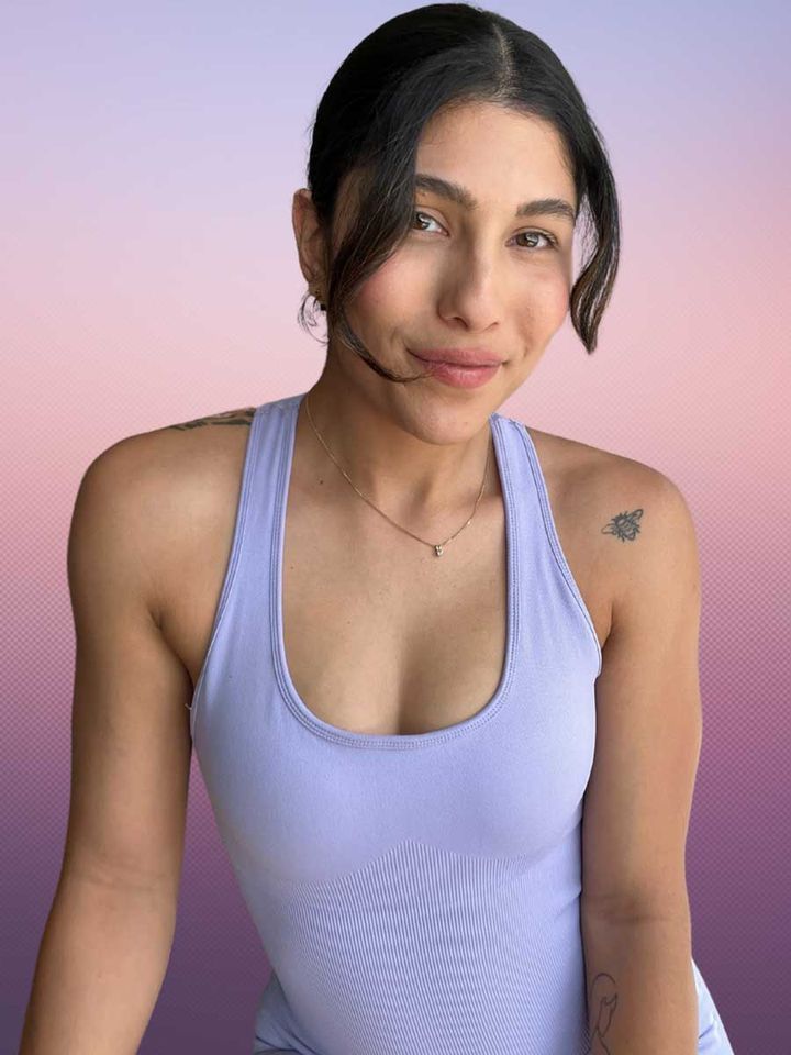Portrait of coach Iman in a lavender workout set